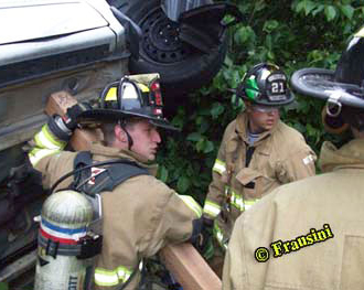 Firefighters at the scene of a motor vehicle accident
